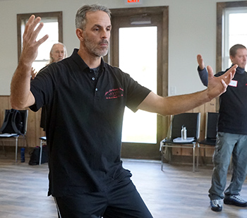 Silver Lotus student practicing Yang 24 Forms tai chi